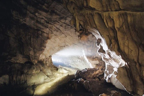 Inside the ancient Pëllumbas Cave, featuring the “Guardian of the Cave” stalactite