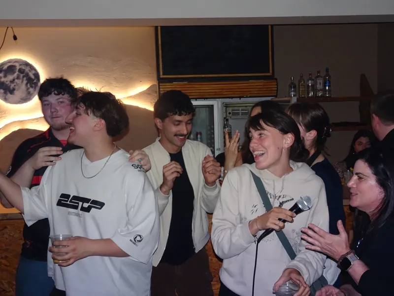 A group of people singing karaoke together.