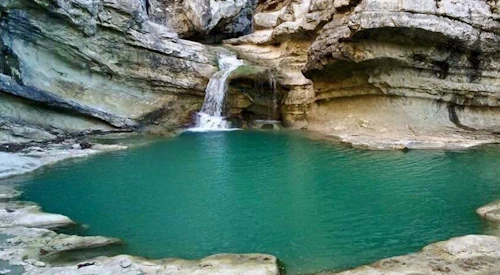 Cyclops Eye waterfall and blue hidden lake