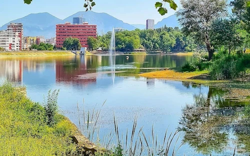 Tirana's artificial lake waterfront on a sunny day